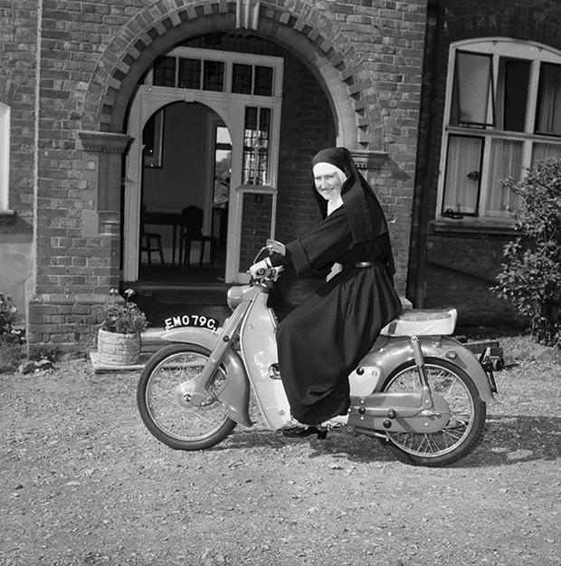 24th September 1965:  Sister Mary Bernadette, an ex-WAAF and now a nun of St John's Convent, Twyford, Berkshire on her motorcycle.  (Photo by Express/Express/Getty Images)